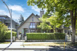 Discover this stunning modern home featuring a striking stucco exterior and a prominent pitched roofline.