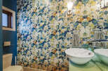 This stylish bathroom features a bold floral wallpaper that adds a vibrant touch to the space.
