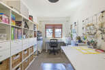 Discover an artist's dream studio, meticulously organized for creativity and productivity.
