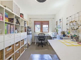 Discover an artist's dream studio, meticulously organized for creativity and productivity.