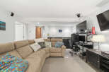 This basement living area offers a comfortable and functional space for relaxation and entertainment.
