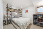 Discover this cozy bedroom featuring a stylish upholstered headboard and a plush duvet for ultimate comfort.