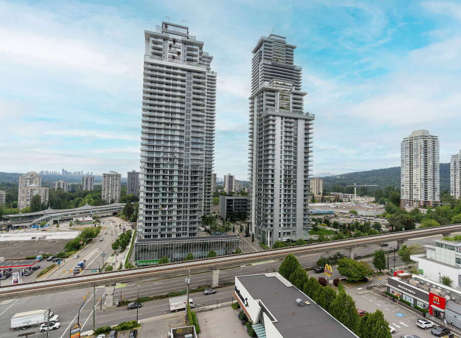 Experience modern urban living in these stunning high-rise apartments, featuring sleek architecture and expansive balconies offering breathtaking city and mountain views.