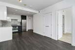 Experience modern living in this stylish apartment featuring a sleek, contemporary kitchen with stainless steel appliances and elegant cabinetry.
