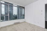 Experience breathtaking city views from this spacious room, featuring expansive windows that flood the space with natural light.