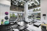 Elevate your fitness routine in this modern gym, featuring state-of-the-art treadmills and ellipticals for cardio enthusiasts.