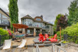 Experience luxurious lakeside living with this stunning property featuring a spacious backyard perfect for entertaining.