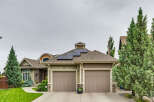 This charming home features a modern aesthetic with solar panels on the roof, perfect for sustainable living.