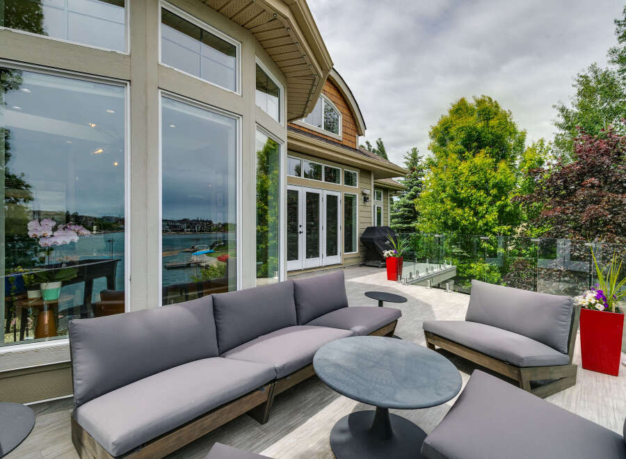 Enjoy stunning waterfront views from this expansive deck, perfect for entertaining or relaxing.