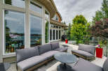 Enjoy stunning waterfront views from this expansive deck, perfect for entertaining or relaxing.