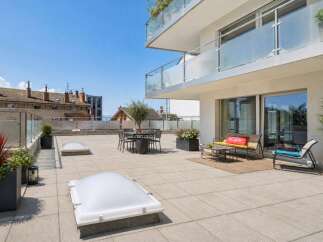 Experience luxurious outdoor living on this expansive rooftop terrace, perfect for entertaining or relaxing.