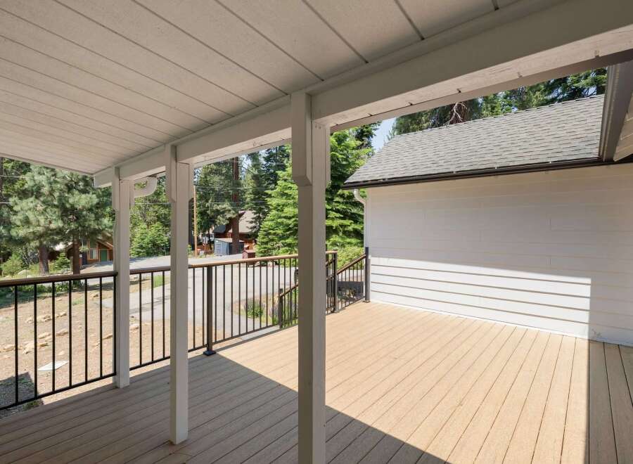 Enjoy the outdoors from this spacious covered deck, perfect for entertaining or relaxing.