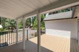 Enjoy the outdoors from this spacious covered deck, perfect for entertaining or relaxing.