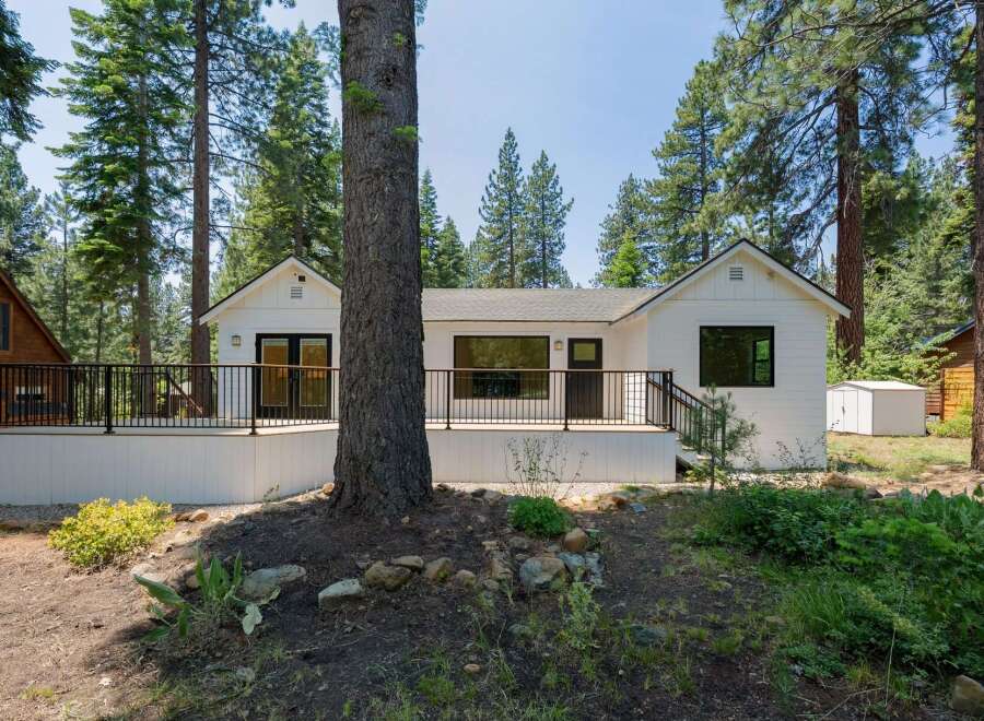 Experience modern living nestled amongst tall pines with this beautifully renovated home.