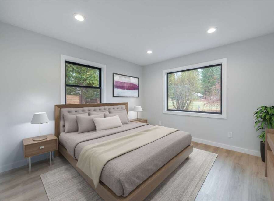 Experience serene living in this beautifully appointed bedroom, featuring a plush tufted headboard and a cozy duvet.
