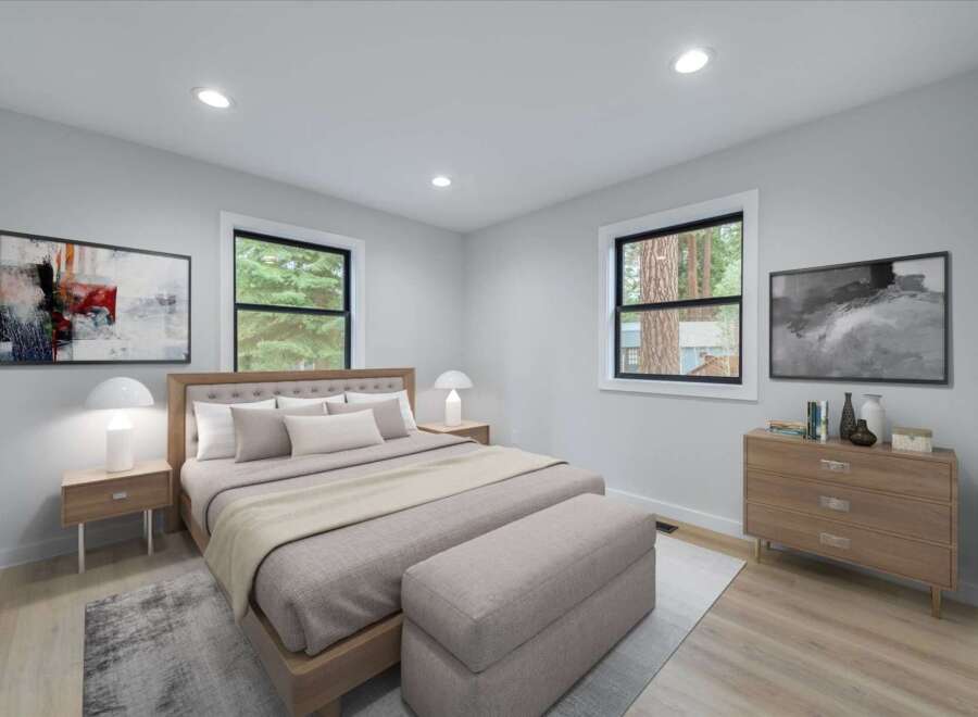 Experience comfort and style in this beautifully staged bedroom, featuring a plush king-sized bed with a tufted headboard and coordinating pillows.