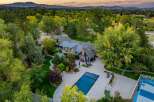 Experience luxury living in this stunning estate featuring a sparkling swimming pool and a private basketball court, perfect for recreation and entertainment.