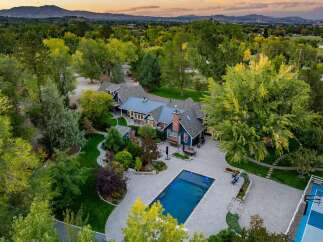 Experience luxury living in this stunning estate featuring a sparkling swimming pool and a private basketball court, perfect for recreation and entertainment.