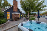 Experience ultimate relaxation in this stunning backyard oasis, featuring a luxurious hot tub perfect for unwinding.