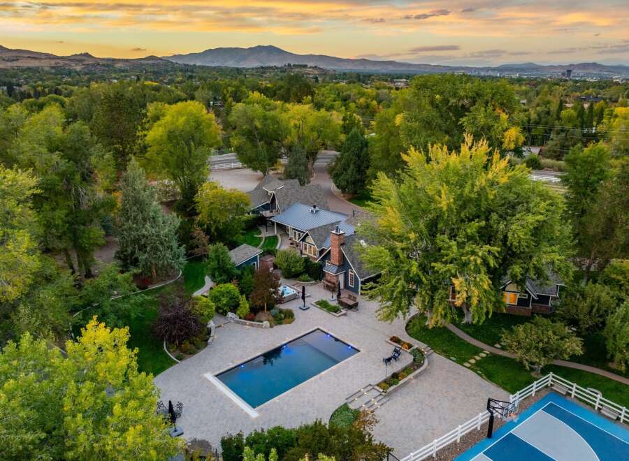Experience luxury living with this stunning estate featuring a pristine swimming pool and a relaxing hot tub, perfect for unwinding.