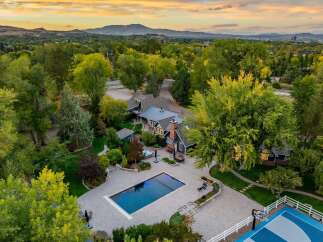 Experience luxury living with this stunning estate featuring a pristine swimming pool and a relaxing hot tub, perfect for unwinding.