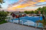 Experience outdoor recreation at its finest with this stunning multi-court facility, perfect for basketball and volleyball enthusiasts.
