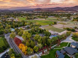 Experience luxury living in this stunning estate featuring a private basketball court and a vibrant equestrian facility, perfect for both recreation and training.