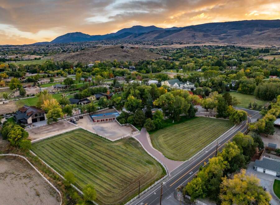 Discover this expansive property featuring meticulously maintained hay fields and riding arenas, perfect for equestrian enthusiasts.
