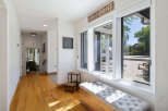 Step into this charming entryway featuring warm hardwood floors and a welcoming ambiance.