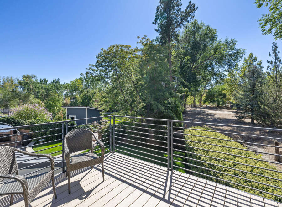 Enjoy the outdoors from this spacious deck, perfect for relaxing or entertaining.