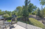 Enjoy the outdoors from this spacious deck, perfect for relaxing or entertaining.