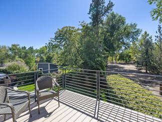 Enjoy the outdoors from this spacious deck, perfect for relaxing or entertaining.