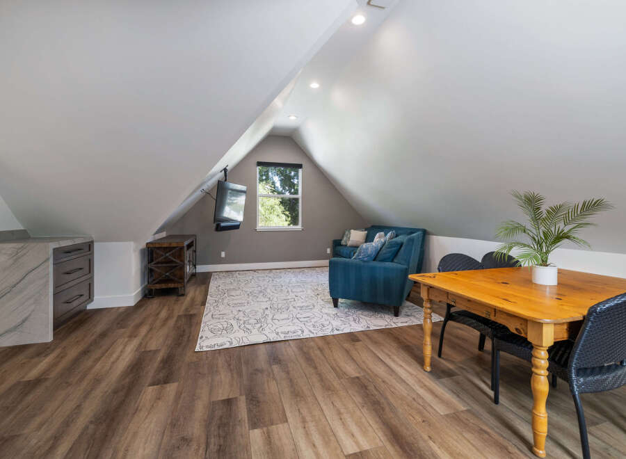 Discover this charming attic space, perfect for a home office or guest suite.
