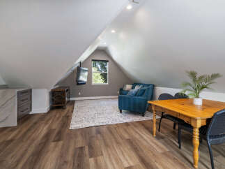 Discover this charming attic space, perfect for a home office or guest suite.