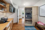 Experience ultimate relaxation in this home featuring a modern infrared sauna, perfect for unwinding after a long day.