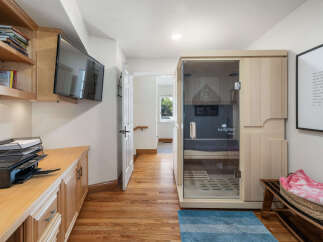 Experience ultimate relaxation in this home featuring a modern infrared sauna, perfect for unwinding after a long day.