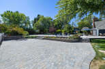 Experience outdoor living at its finest with this expansive paver patio, perfect for entertaining.