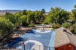 Enjoy outdoor recreation with a private basketball court and a sparkling swimming pool, perfect for family fun and entertaining.