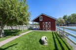 Discover this charming red barn, perfect for equestrian enthusiasts or as a versatile storage space.