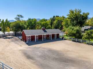 Discover this charming red barn, perfect for equestrian enthusiasts or as a versatile storage solution.