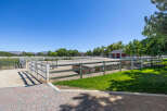 Experience equestrian living at its finest with this expansive property featuring a professional riding arena and multiple fenced pastures.