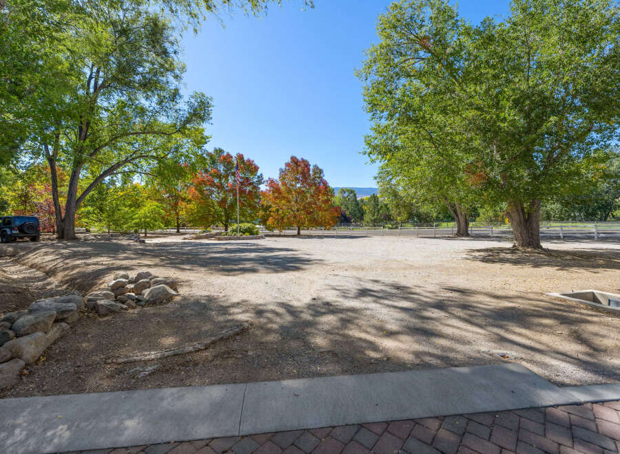 Discover this expansive property featuring mature trees and vibrant autumn foliage, perfect for creating your dream home or equestrian estate.