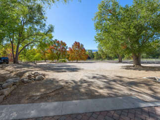 Discover this expansive property featuring mature trees and vibrant autumn foliage, perfect for creating your dream home or equestrian estate.