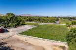 Discover this expansive property featuring a charming red barn and a spacious riding arena, perfect for equestrian enthusiasts.