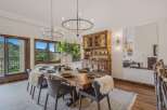 Experience elegant dining with this stunning wooden table, perfectly set for intimate gatherings.