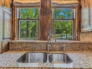 Experience the perfect blend of rustic charm and modern convenience in this stunning kitchen.