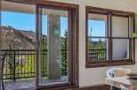 Experience breathtaking mountain views from this stunning property, featuring a spacious balcony perfect for enjoying the serene landscape.