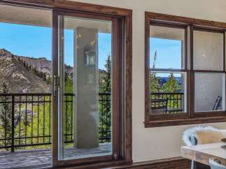 Experience breathtaking mountain views from this stunning property, featuring a spacious balcony perfect for enjoying the serene landscape.