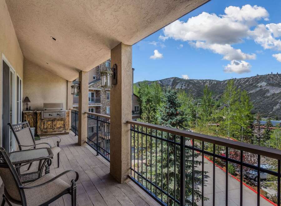 Enjoy breathtaking mountain views from this spacious balcony, perfect for outdoor dining and relaxation.
