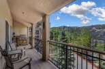 Enjoy breathtaking mountain views from this spacious balcony, perfect for outdoor dining and relaxation.